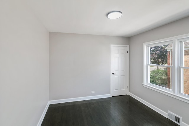 2263 S 14th Ave, North Riverside, IL 60546 - spare room featuring baseboards and dark wood-style flooring