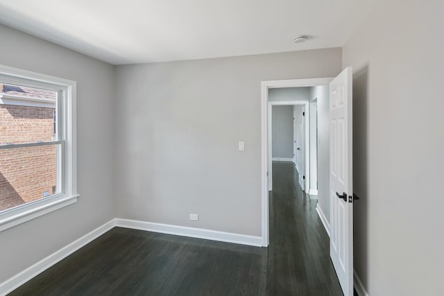 2263 S 14th Ave, North Riverside, IL 60546 - unfurnished room with dark wood-style floors, healthy amount of natural light, and a smoke detector