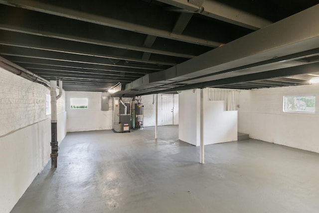 2263 S 14th Ave, North Riverside, IL 60546 - basement featuring gas water heater, heating unit, and electric panel