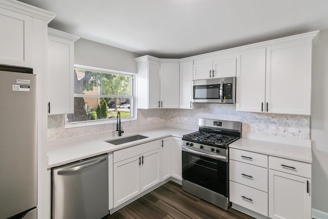 2263 S 14th Ave, North Riverside, IL 60546 - kitchen with appliances with stainless steel finishes, white cabinets, light countertops, and backsplash