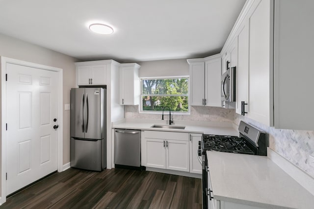 2263 S 14th Ave, North Riverside, IL 60546 - kitchen featuring stainless steel appliances, tasteful backsplash, dark wood-style floors, and white cabinets