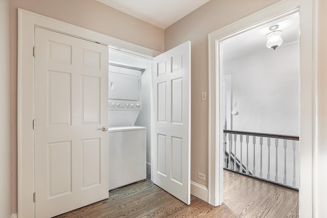 718 S Washington Ave, Park Ridge, IL 60068 - laundry room featuring stacked washer / drying machine and wood finished floors