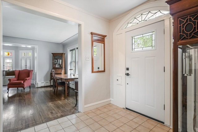 718 S Washington Ave, Park Ridge, IL 60068 - entrance foyer with light tile patterned flooring and a baseboard heating unit