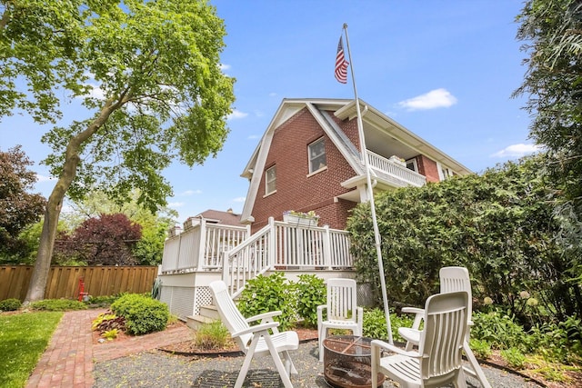 718 S Washington Ave, Park Ridge, IL 60068 - back of house with brick siding, stairway, an outdoor fire pit, and a deck