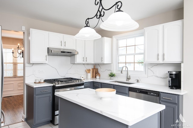 8619 Koehler Dr, Tinley Park, IL 60487 - kitchen featuring appliances with stainless steel finishes, under cabinet range hood, gray cabinetry, and a kitchen island