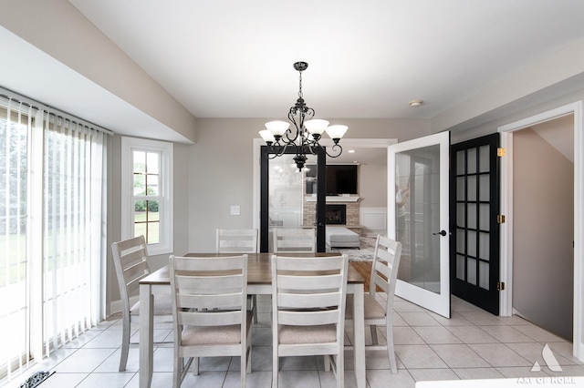 8619 Koehler Dr, Tinley Park, IL 60487 - dining area with a chandelier, light tile patterned flooring, and french doors