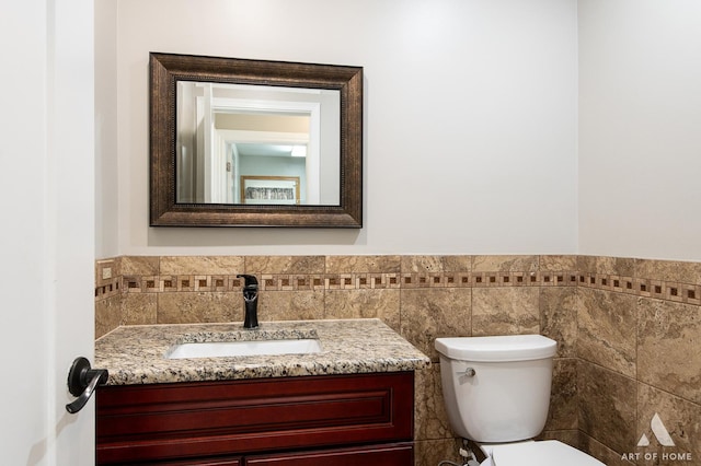 8619 Koehler Dr, Tinley Park, IL 60487 - half bathroom with vanity, tile walls, and wainscoting