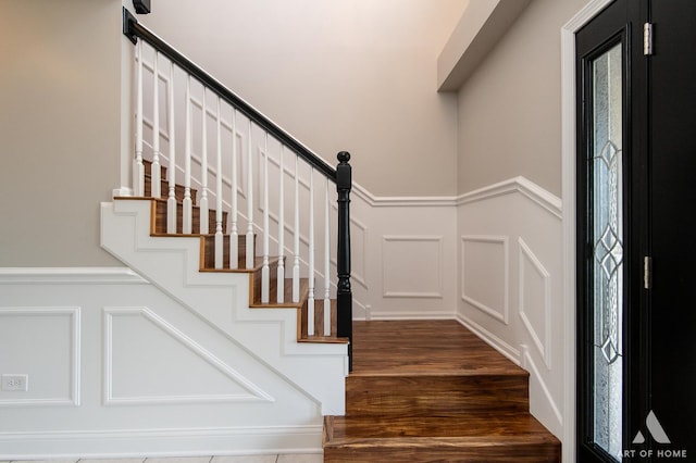 8619 Koehler Dr, Tinley Park, IL 60487 - stairway with a decorative wall, wood finished floors, and wainscoting
