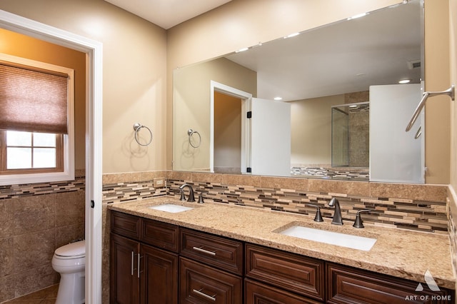 8619 Koehler Dr, Tinley Park, IL 60487 - full bath with double vanity, a stall shower, tile walls, and tile patterned flooring