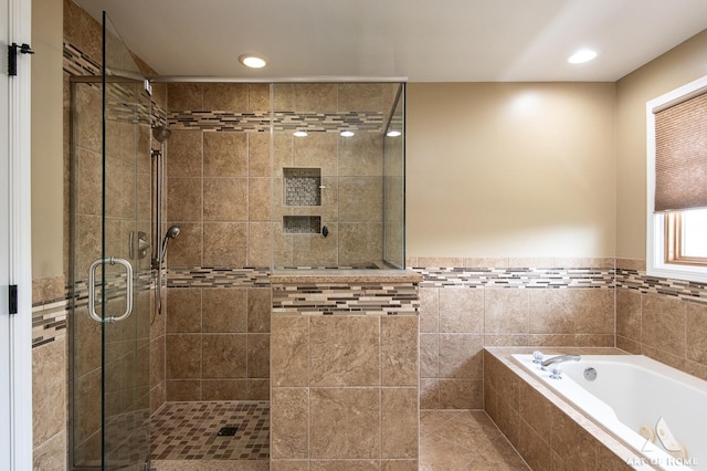 8619 Koehler Dr, Tinley Park, IL 60487 - full bathroom featuring a shower stall, a bath, recessed lighting, tile walls, and a wainscoted wall