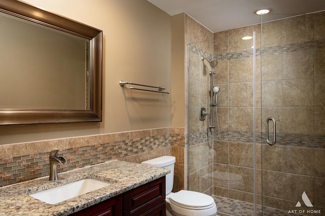 8619 Koehler Dr, Tinley Park, IL 60487 - full bathroom featuring vanity, a shower stall, a wainscoted wall, and tile walls