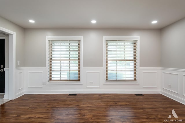 8619 Koehler Dr, Tinley Park, IL 60487 - spare room with a wainscoted wall, dark wood-type flooring, recessed lighting, and a decorative wall