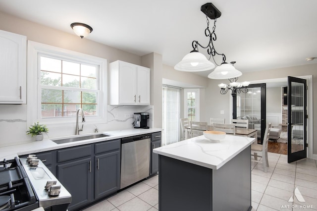 8619 Koehler Dr, Tinley Park, IL 60487 - kitchen featuring stainless steel dishwasher, light tile patterned floors, healthy amount of natural light, and a kitchen island