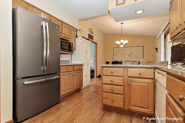 3406 W Bretons Dr, Mchenry, IL 60050 - kitchen featuring freestanding refrigerator, light wood finished floors, a chandelier, a peninsula, and brown cabinetry