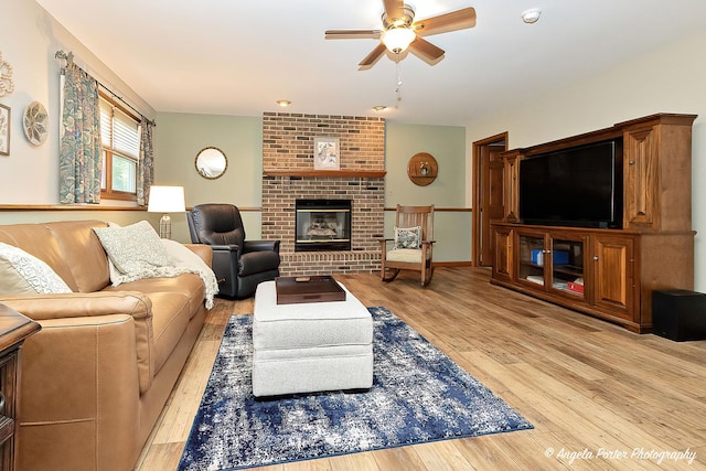 3406 W Bretons Dr, Mchenry, IL 60050 - living room with a ceiling fan, wood finished floors, and a brick fireplace