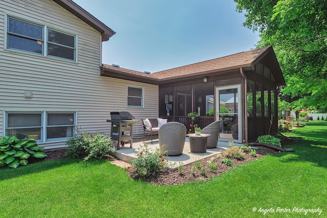 3406 W Bretons Dr, Mchenry, IL 60050 - back of house featuring a sunroom, a patio, a lawn, and a shingled roof