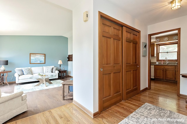 3406 W Bretons Dr, Mchenry, IL 60050 - hall featuring light wood-style flooring and a sink