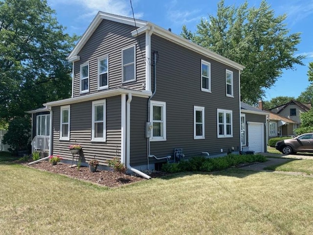 700 W Lafayette St, Ottawa, IL 61350 - view of property exterior featuring a garage and a yard
