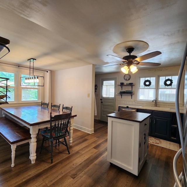 700 W Lafayette St, Ottawa, IL 61350 - kitchen with dark wood-style floors, dark countertops, a center island, and a ceiling fan