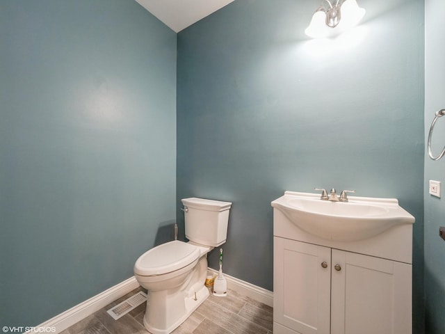 11880 Everglades Rd, Huntley, IL 60142 - half bathroom with vanity and wood finish floors