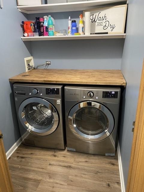 11880 Everglades Rd, Huntley, IL 60142 - laundry room with washing machine and dryer and wood finished floors