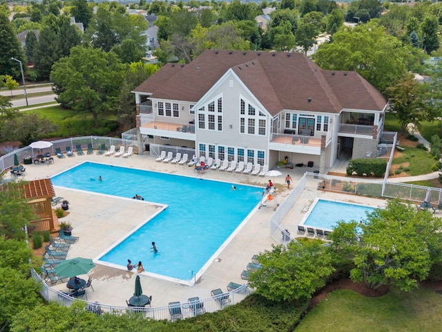 900 Heartland Park Ln, Antioch, IL 60002 - community pool with a patio and view of wooded area