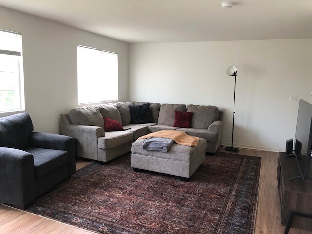 900 Heartland Park Ln, Antioch, IL 60002 - living area featuring wood finished floors and healthy amount of natural light