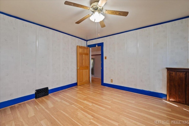 12 N Lincolnway Ave, North Aurora, IL 60542 - unfurnished room with wood finished floors and a ceiling fan