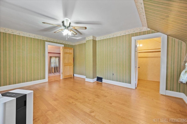 12 N Lincolnway Ave, North Aurora, IL 60542 - unfurnished living room featuring wallpapered walls, wood finished floors, and ceiling fan