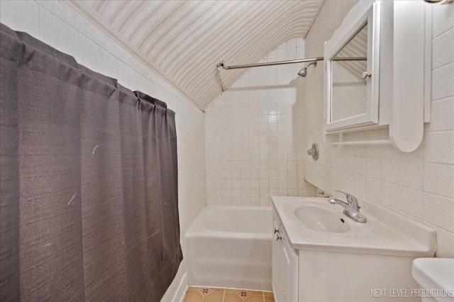 12 N Lincolnway Ave, North Aurora, IL 60542 - full bath featuring tile walls, vanity, tile patterned floors, shower / bath combination with curtain, and decorative backsplash