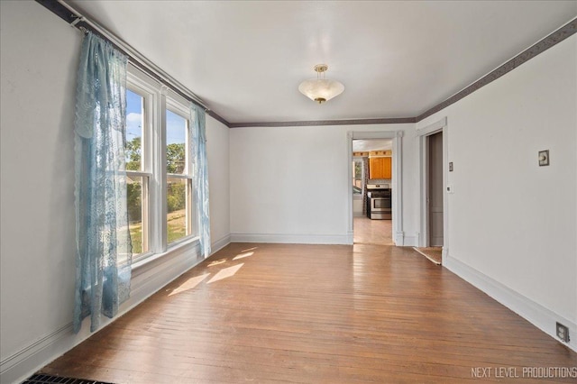 12 N Lincolnway Ave, North Aurora, IL 60542 - spare room with wood finished floors and crown molding