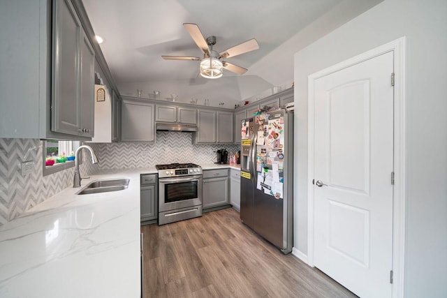 2113 Lolo Pass Dr, Plainfield, IL 60586 - kitchen with stainless steel appliances, gray cabinets, a ceiling fan, tasteful backsplash, and wood finished floors
