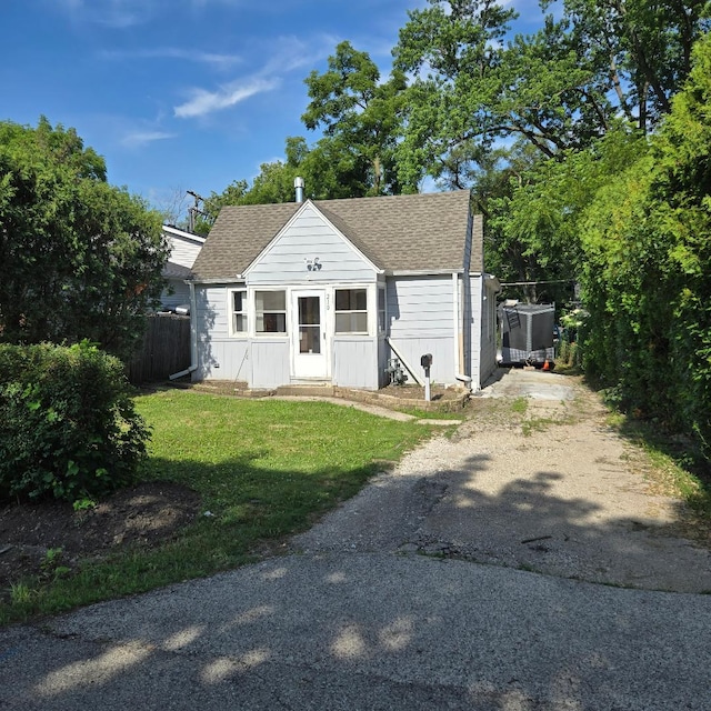 210 Brierhill Dr, Round Lake Park, IL 60073 - bungalow with a shingled roof and dirt driveway