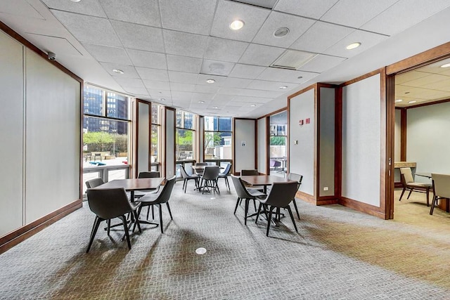 222 N Columbus Dr Unit 4803, Chicago, IL 60601 - carpeted dining space featuring a wall of windows, recessed lighting, and a paneled ceiling
