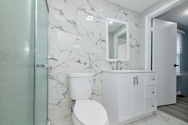257 N Grace St, Lombard, IL 60148 - bathroom featuring vanity, tile walls, marble finish floors, and a stall shower