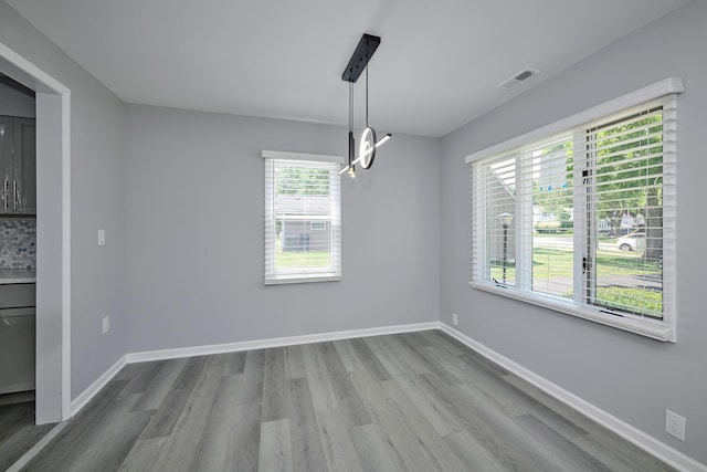 257 N Grace St, Lombard, IL 60148 - unfurnished dining area featuring wood finished floors and a chandelier