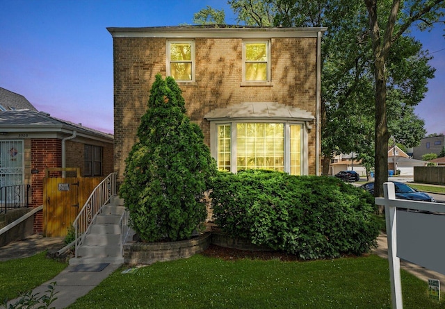 3901 N Neva Ave, Chicago, IL 60634 - view of front of house with brick siding and a lawn