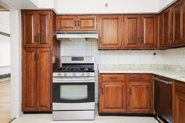 3901 N Neva Ave, Chicago, IL 60634 - kitchen featuring appliances with stainless steel finishes, under cabinet range hood, decorative backsplash, and brown cabinets