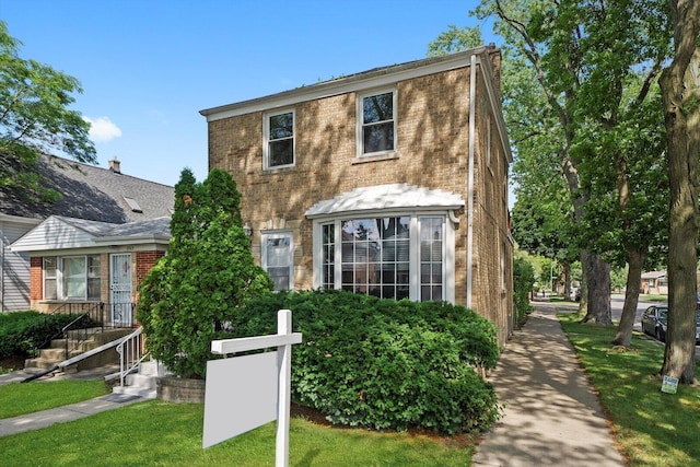 3901 N Neva Ave, Chicago, IL 60634 - view of front of house with brick siding and a front lawn