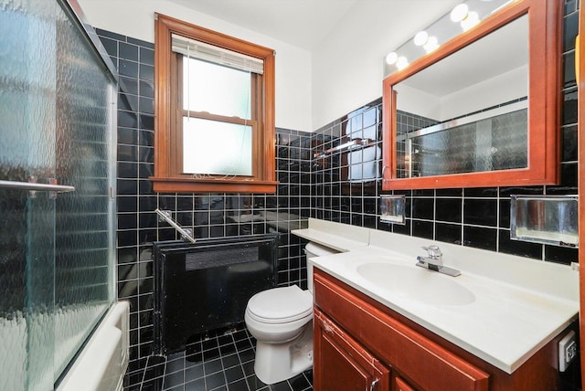 3901 N Neva Ave, Chicago, IL 60634 - full bathroom featuring tile walls, vanity, tile patterned floors, shower / bath combination with glass door, and tasteful backsplash
