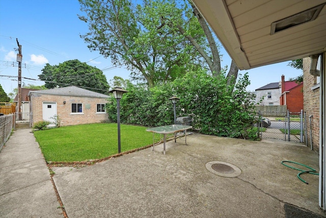 3901 N Neva Ave, Chicago, IL 60634 - view of yard with a patio, a gate, and an outdoor structure
