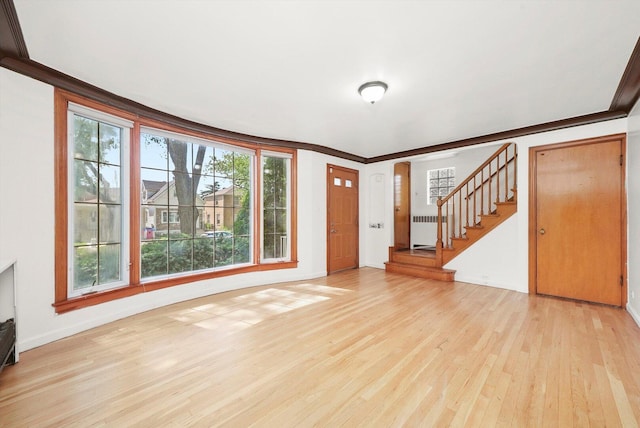 3901 N Neva Ave, Chicago, IL 60634 - entrance foyer with radiator heating unit, light wood finished floors, healthy amount of natural light, stairs, and ornamental molding