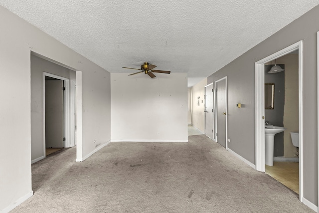 119 Boardwalk St Unit 1W, Elk Grove Village, IL 60007 - unfurnished room with ceiling fan, carpet floors, and a textured ceiling