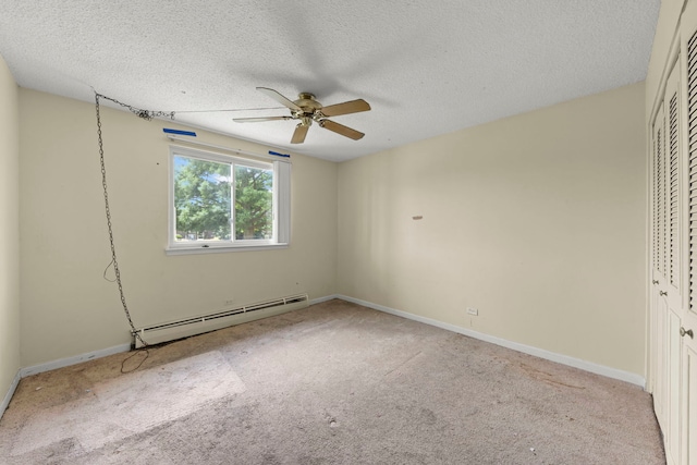 119 Boardwalk St Unit 1W, Elk Grove Village, IL 60007 - unfurnished bedroom featuring a baseboard radiator, a closet, carpet flooring, a textured ceiling, and ceiling fan