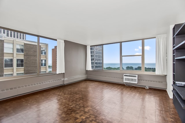 360 W Wellington Ave Unit 13E, Chicago, IL 60657 - spare room with an AC wall unit and baseboards