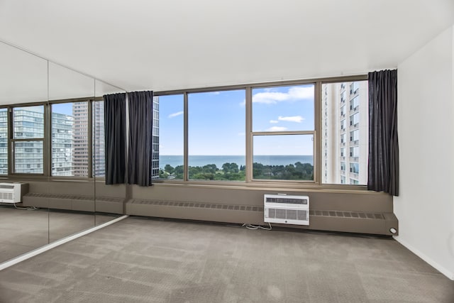 360 W Wellington Ave Unit 13E, Chicago, IL 60657 - spare room featuring carpet, a water view, and a wall mounted AC