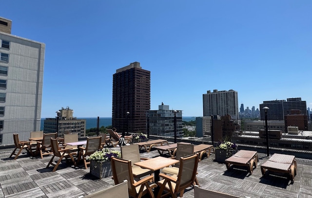 360 W Wellington Ave Unit 13E, Chicago, IL 60657 - view of patio / terrace with a view of skyline and outdoor dining area