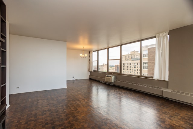 360 W Wellington Ave Unit 13E, Chicago, IL 60657 - empty room featuring a chandelier and an AC wall unit
