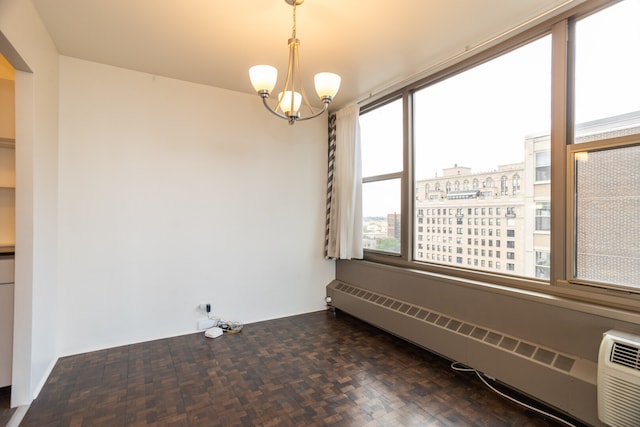 360 W Wellington Ave Unit 13E, Chicago, IL 60657 - unfurnished dining area with a baseboard radiator, plenty of natural light, a chandelier, and a view of city