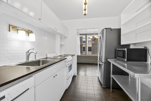 360 W Wellington Ave Unit 13E, Chicago, IL 60657 - kitchen featuring white appliances, tasteful backsplash, white cabinetry, and open shelves